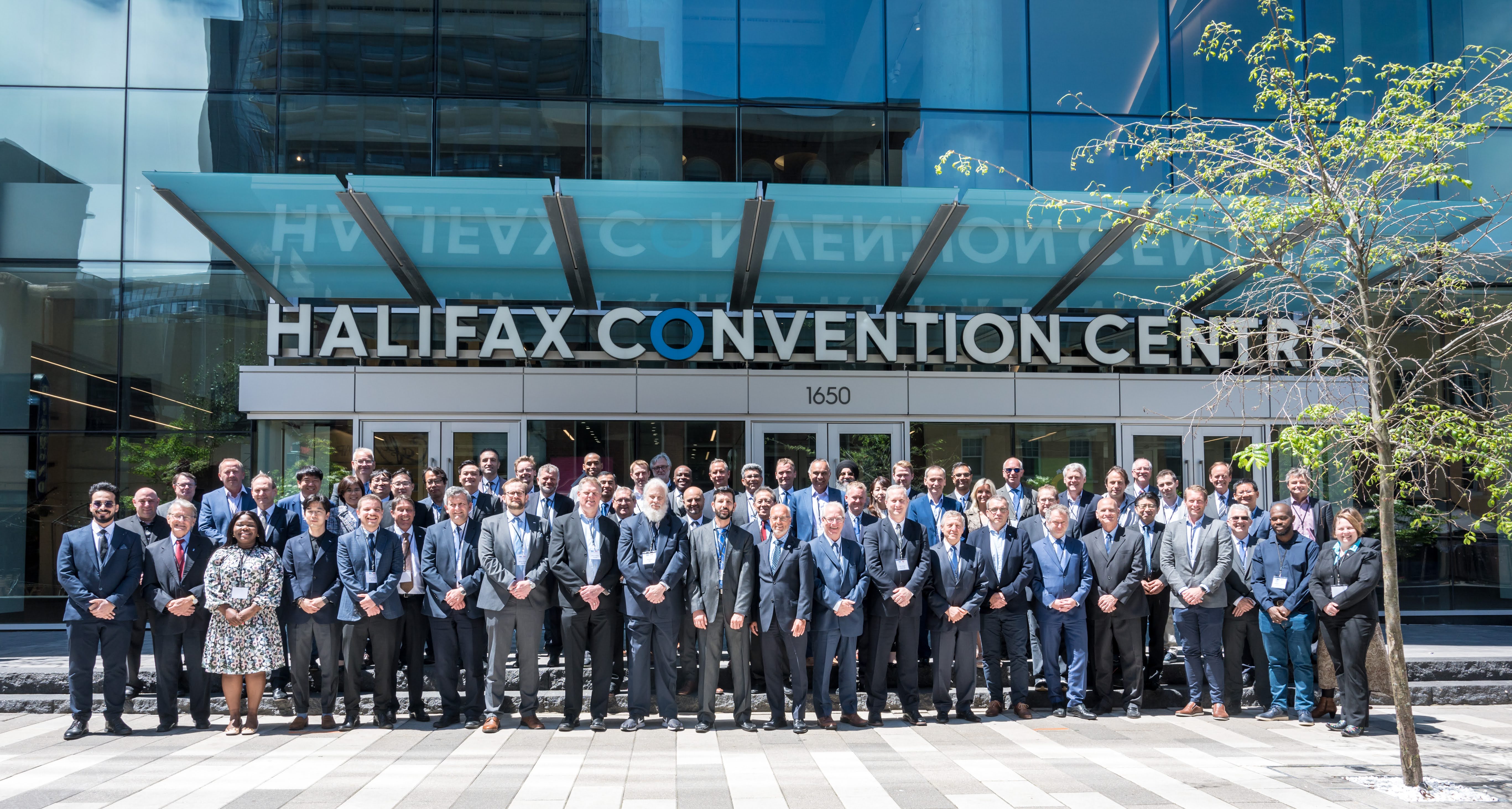 IECEE attendees pose for a photo outside Halifax Convention Centre on Argyle Street